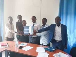 Emmanuel Nuwagaba (in blue suit) together with other 5 students after the awarding ceremony at the UIPE offices in Kyambogo